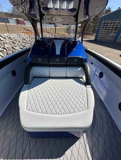 Slide: The Image of 2019 Mystic Powerboats M4200 interior with cushioned seating and sleek design. - 15