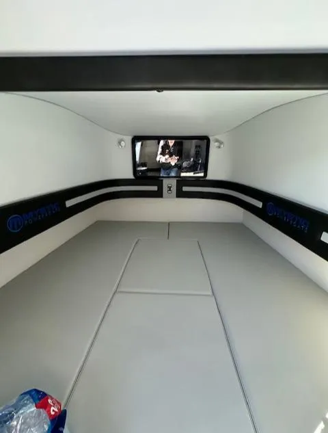 Slide: The Image of 2019 Mystic Powerboats M4200 cabin interior with sleek design and comfortable seating. - 24