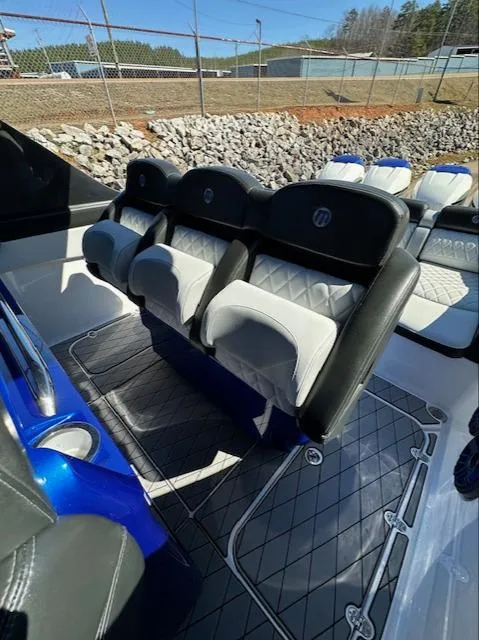 Slide: The Image of 2019 Mystic Powerboats M4200 interior with luxurious seating and modern design. - 27