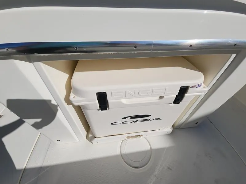 Slide: The Image of 2025 Cobia 265 Center Console with Engel cooler storage compartment. - 10