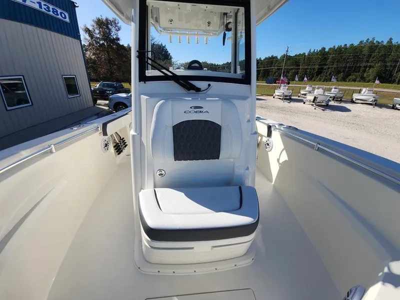 Slide: The Image of 2025 Cobia 265 Center Console boat interior with seating and console view. - 18