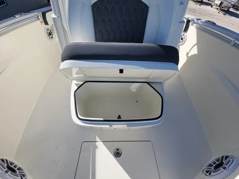 Slide: The Image of 2025 Cobia 265 Center Console boat with open storage compartment. - 19