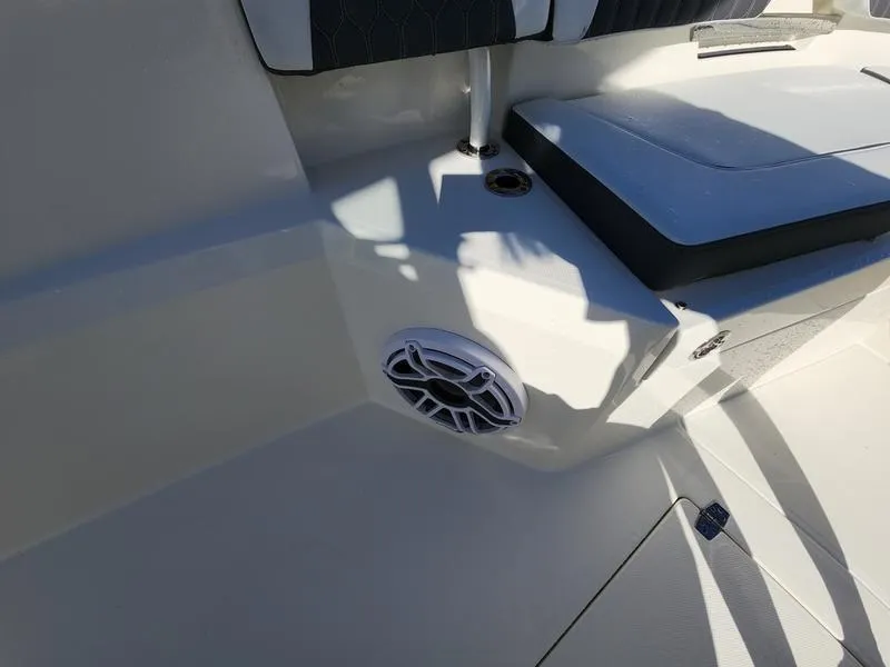 Slide: The Image of 2025 Cobia 265 Center Console boat interior with speaker and seating detail. - 31