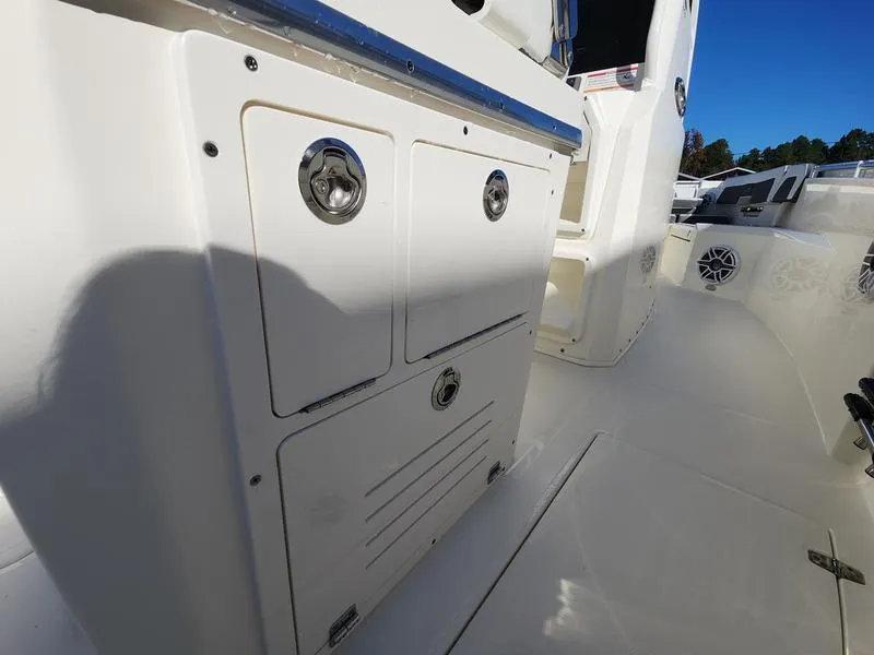 Slide: The Image of 2025 Cobia 265 Center Console boat interior with storage compartments and sleek design. - 36