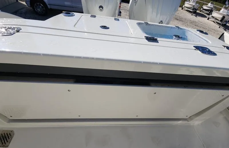 Slide: The Image of 2025 Cobia 265 Center Console boat deck with storage compartments. - 39
