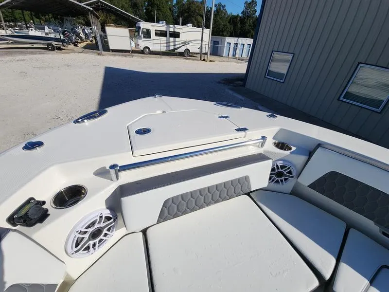 Slide: The Image of 2025 Cobia 265 Center Console boat interior with seating and speakers. - 42