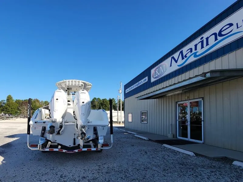 Slide: The Image of 2025 Cobia 265 Center Console boat at E&M Marine dealership. - 5