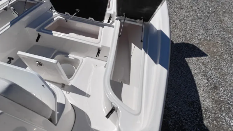 Slide: The Image of 2025 Sea Fox 231 Bay Fox boat storage compartments and seating area. - 11