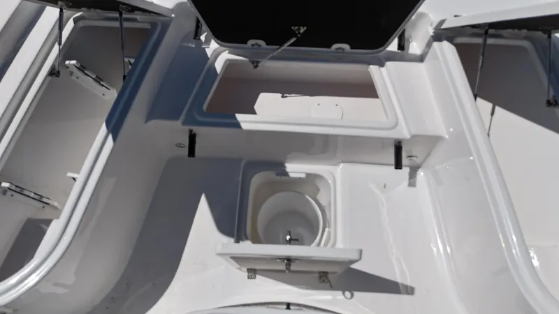 Slide: The Image of 2025 Sea Fox 231 Bay Fox boat interior with storage compartments and sink. - 13