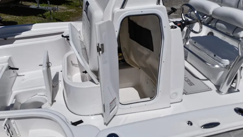 Slide: The Image of 2025 Sea Fox 231 Bay Fox boat interior with open storage compartments and seating. - 17