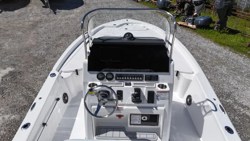Slide: The Image of 2025 Sea Fox 231 Bay Fox boat cockpit with steering wheel and control panel. - 20