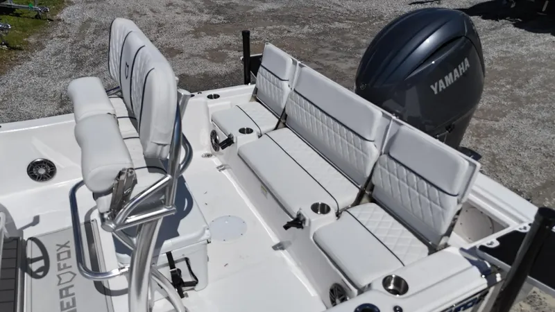 Slide: The Image of 2025 Sea Fox 231 Bay Fox boat interior with Yamaha engine, featuring white cushioned seating. - 23