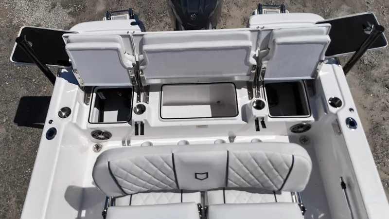 Slide: The Image of 2025 Sea Fox 231 Bay Fox boat interior with white seating and storage compartments. - 25