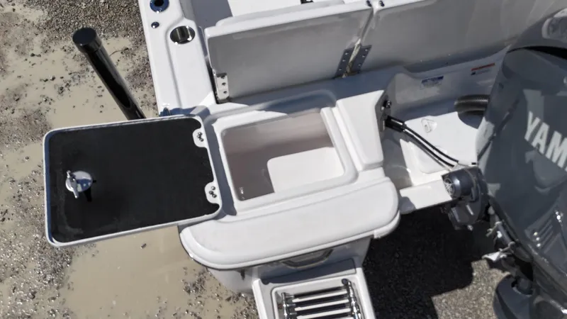 Slide: The Image of 2025 Sea Fox 231 Bay Fox boat stern with Yamaha motor and storage compartments. - 26