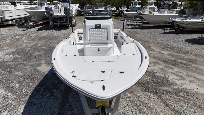 Slide: The Image of 2025 Sea Fox 231 Bay Fox boat on display in a marina setting. - 7