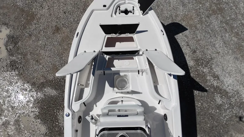 Slide: The Image of 2025 Sea Fox 231 Bay Fox boat, aerial view, showcasing deck layout and storage compartments. - 9