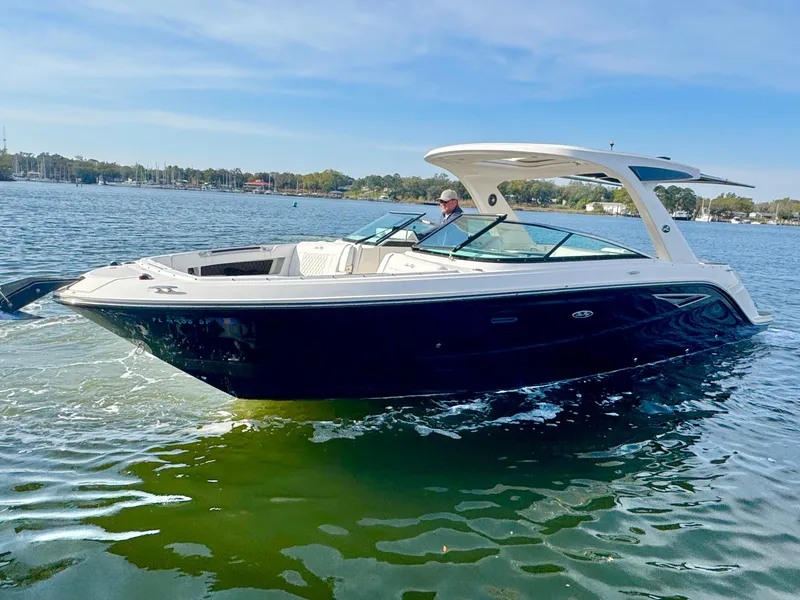 The Image of 2019 Sea Ray SLX 310 boat cruising on a sunny day. - 0