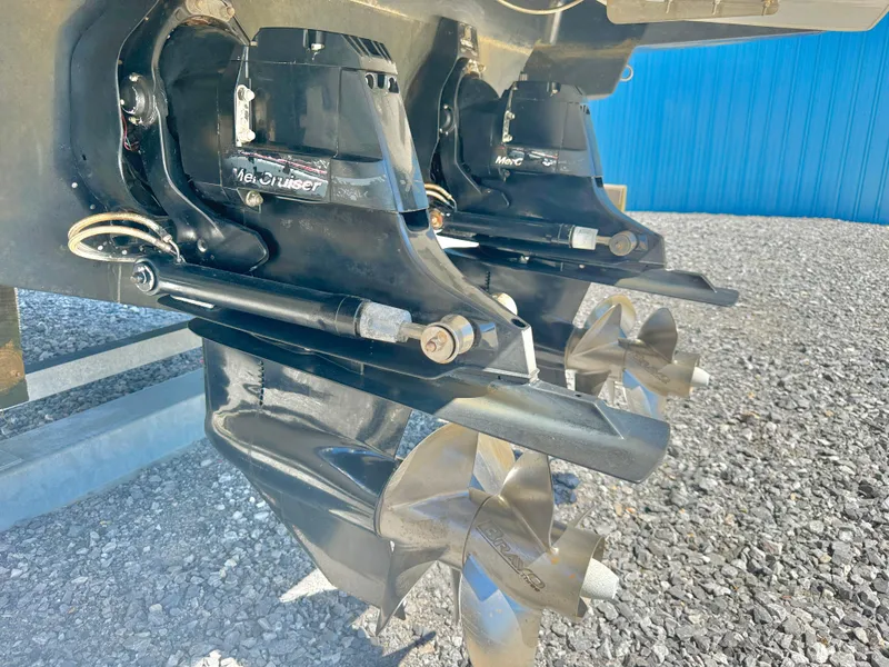 Slide: The Image of Dual propellers of a 2019 Sea Ray SLX 310 boat on gravel surface. - 40