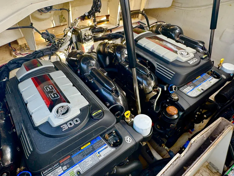 Slide: The Image of Twin Mercury engines in a 2019 Sea Ray SLX 310 boat engine compartment. - 41