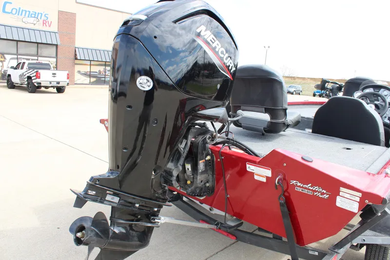 Slide: The Image of 2022 Tracker Pro Team 175 TXW boat with Mercury outboard motor, parked at dealership. - 12