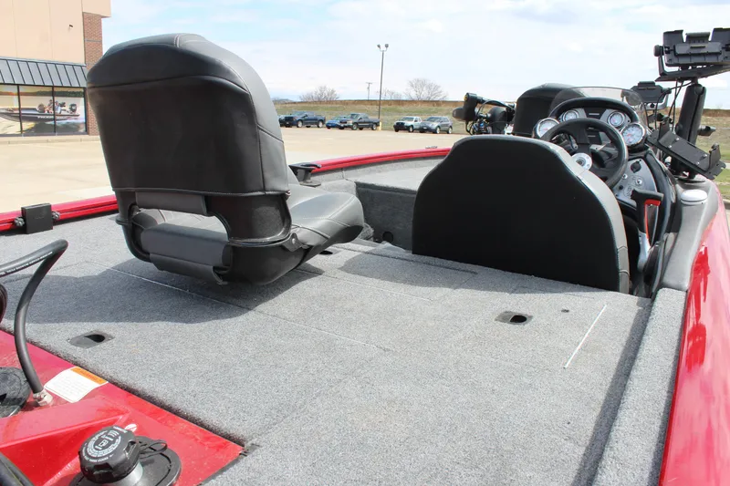 Slide: The Image of 2022 Tracker Pro Team 175 TXW boat interior with seating and dashboard. - 13
