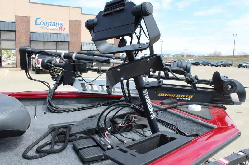 Slide: The Image of 2022 Tracker Pro Team 175 TXW boat with Minn Kota trolling motor in parking lot. - 16