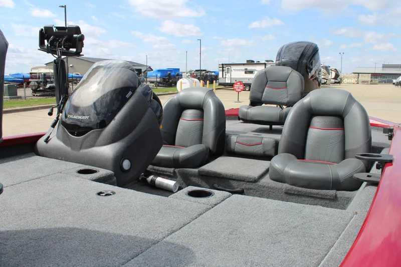 Slide: The Image of 2022 Tracker Pro Team 175 TXW boat interior with gray seating and control panel. - 18