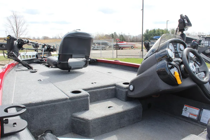 Slide: The Image of 2022 Tracker Pro Team 175 TXW boat interior with steering console and seating. - 19