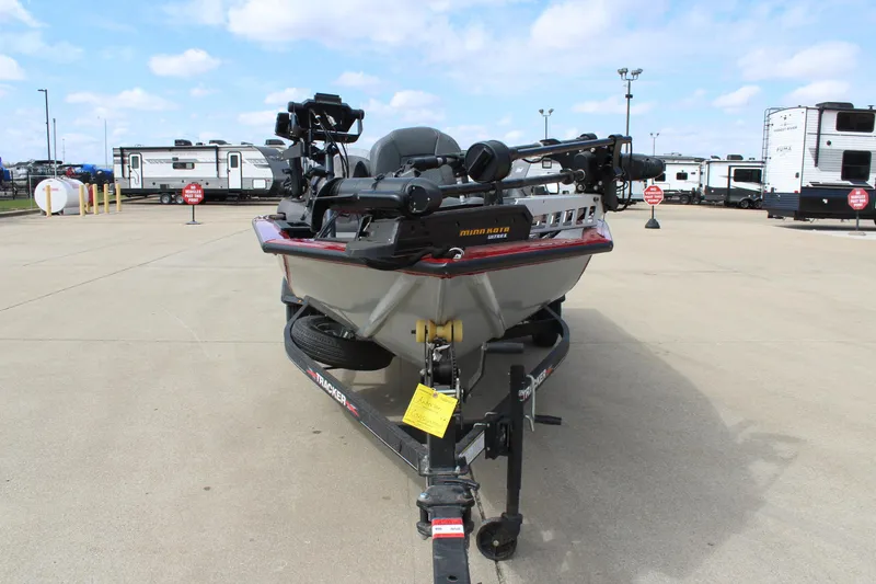 Slide: The Image of 2022 Tracker Pro Team 175 TXW boat on trailer in parking lot. - 2