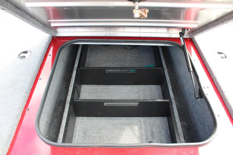 Slide: The Image of Open storage compartment in 2022 Tracker Pro Team 175 TXW boat. - 25
