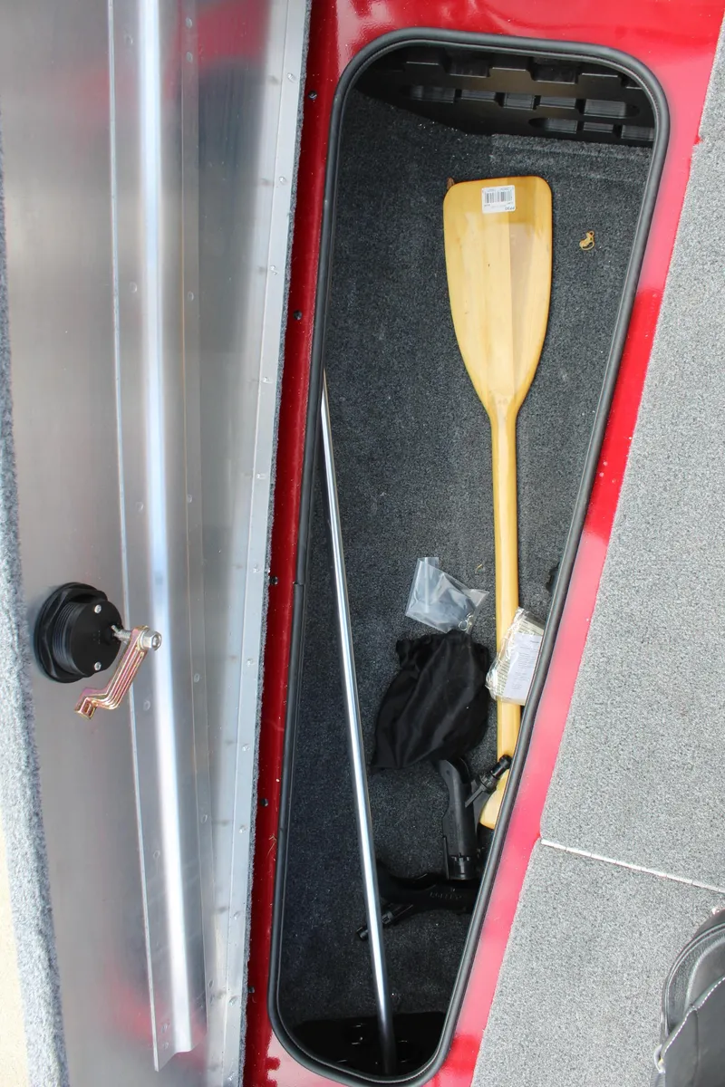 Slide: The Image of 2022 Tracker Pro Team 175 TXW storage compartment with paddle and accessories. - 27