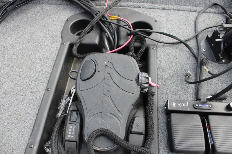 Slide: The Image of Foot pedal controls on 2022 Tracker Pro Team 175 TXW boat deck. - 33