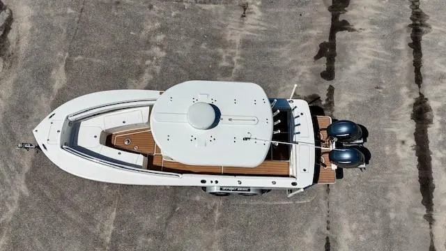 Slide: The Image of Aerial view of 2016 Regulator 25 boat with dual engines on a trailer. - 1