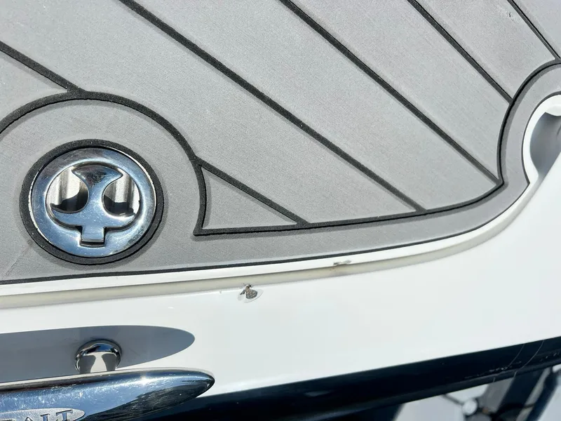 Slide: The Image of 2004 Cobalt 282 boat detail with emblem and sleek design. - 15