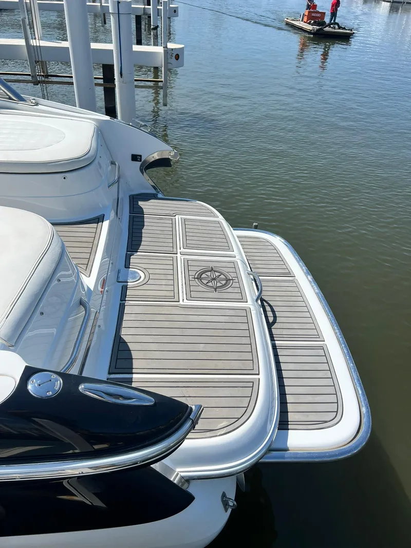 Slide: The Image of 2004 Cobalt 282 boat with sleek swim platform on calm water. - 25