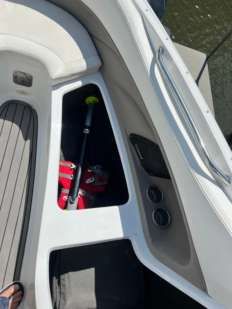 Slide: The Image of 2004 Cobalt 282 boat interior with storage compartment and accessories. - 9
