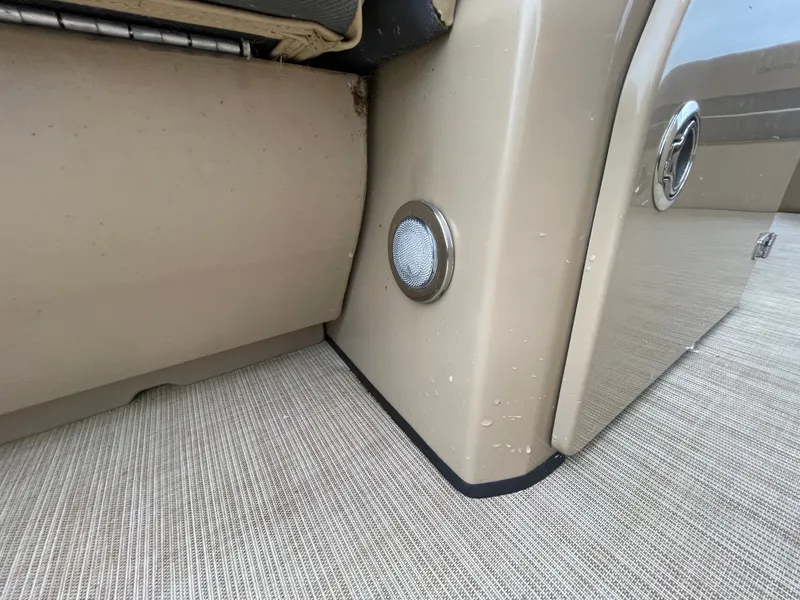 Slide: The Image of 2023 Harris Cruiser 230 interior detail with beige seating and flooring. - 29