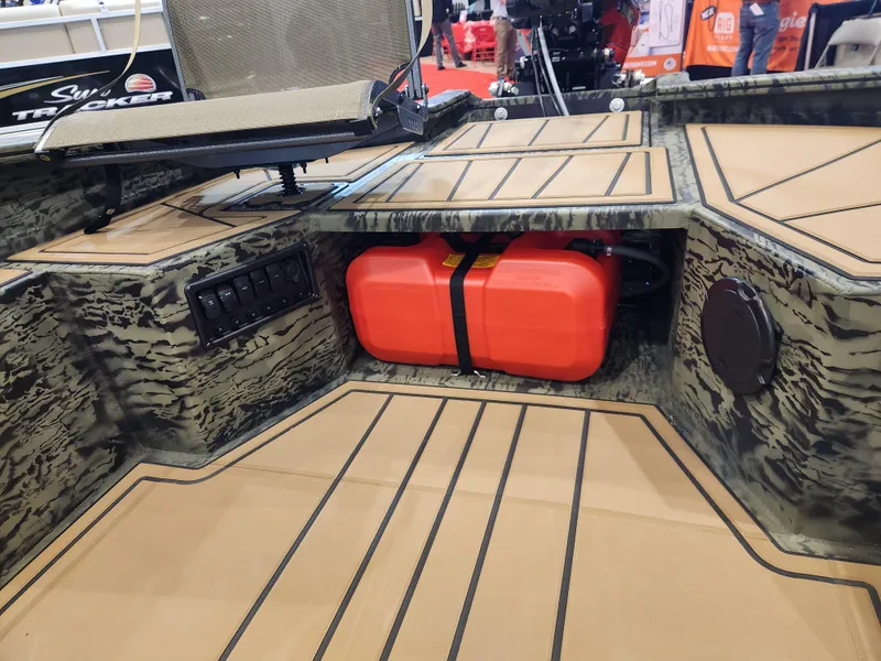 Slide: The Image of 2025 Tracker Grizzly 1650 T Prairie Wings Edition interior with camo design and red fuel tank. - 6