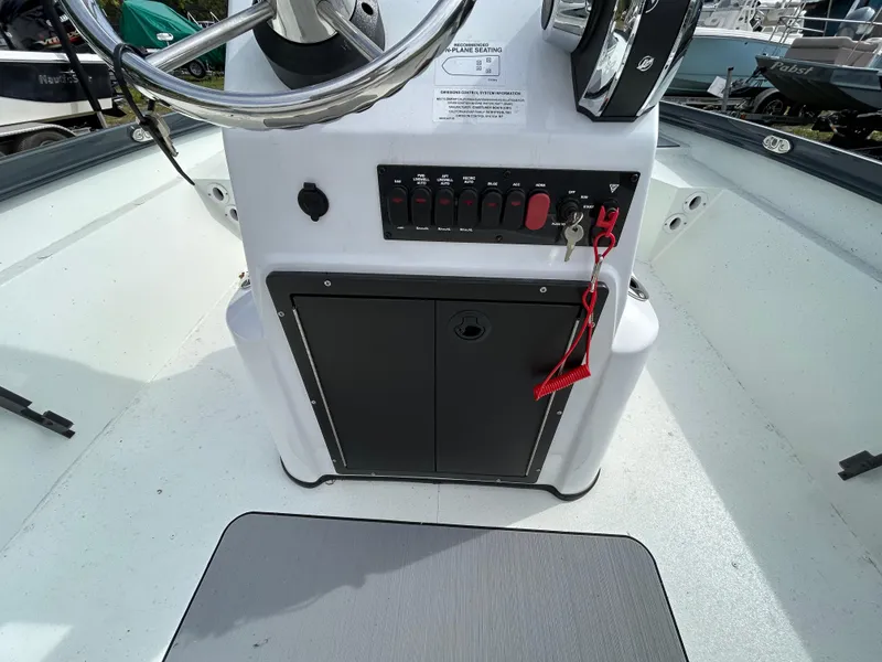 Slide: The Image of 2025 Crestliner 1800 Bay boat console with steering wheel and control panel. - 11
