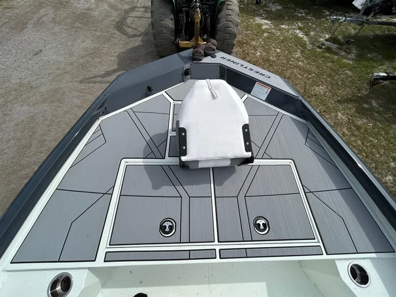 Slide: The Image of 2025 Crestliner 1800 Bay boat deck with modern design and storage compartments. - 14