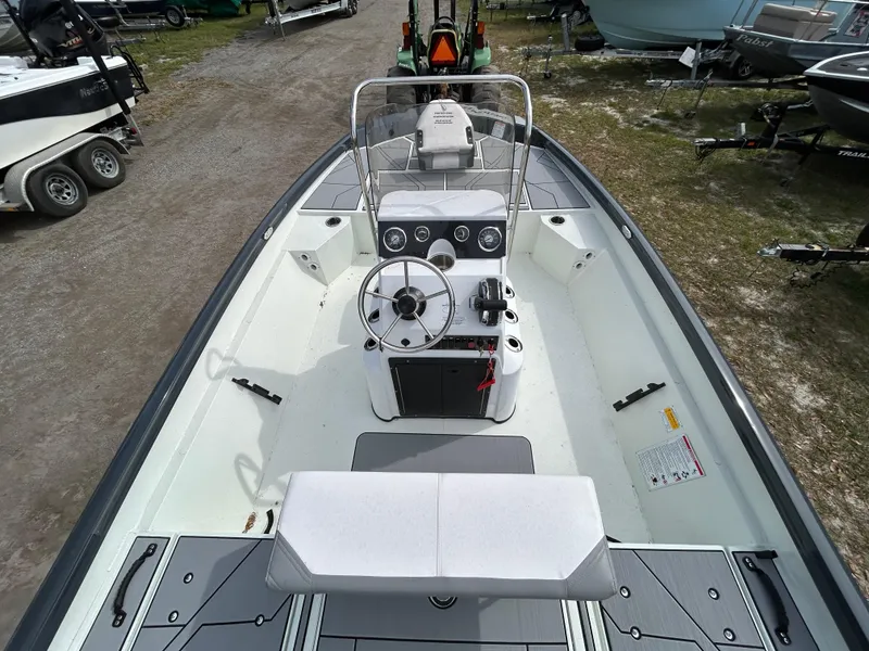 Slide: The Image of 2025 Crestliner 1800 Bay boat interior with steering console and seating. - 8