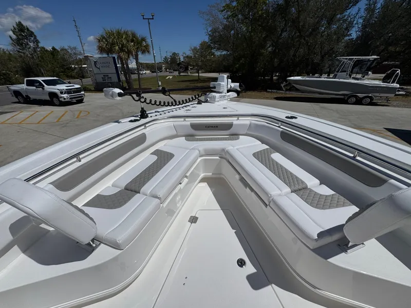 Slide: The Image of 2025 Caymas 291 boat with spacious seating, parked outdoors under a clear sky. - 20