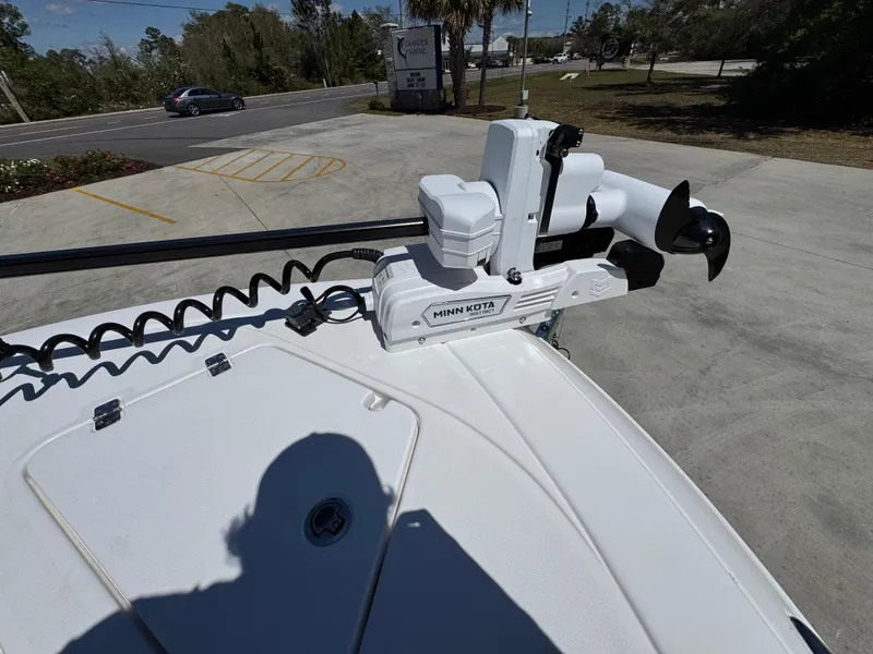 Slide: The Image of 2025 Caymas 291 boat with Minn Kota trolling motor on deck. - 21