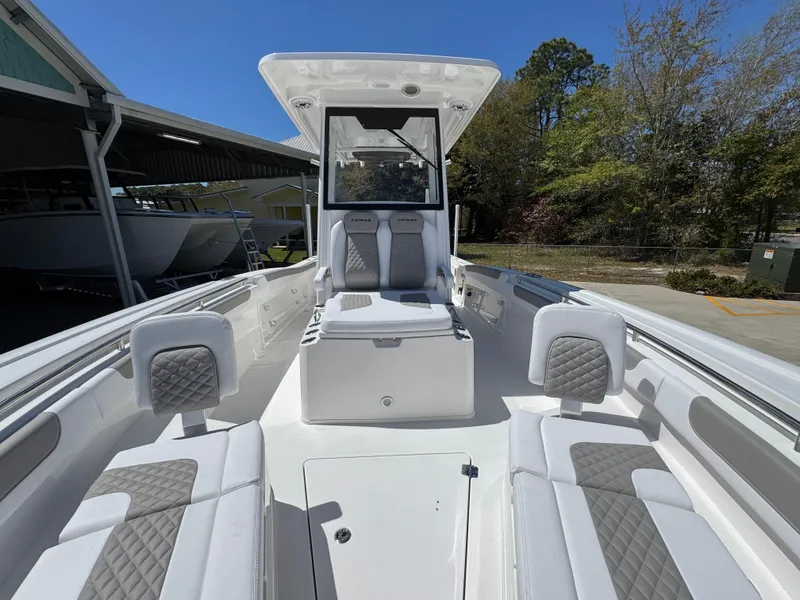 Slide: The Image of 2025 Caymas 291 boat interior with white seating and modern design. - 24