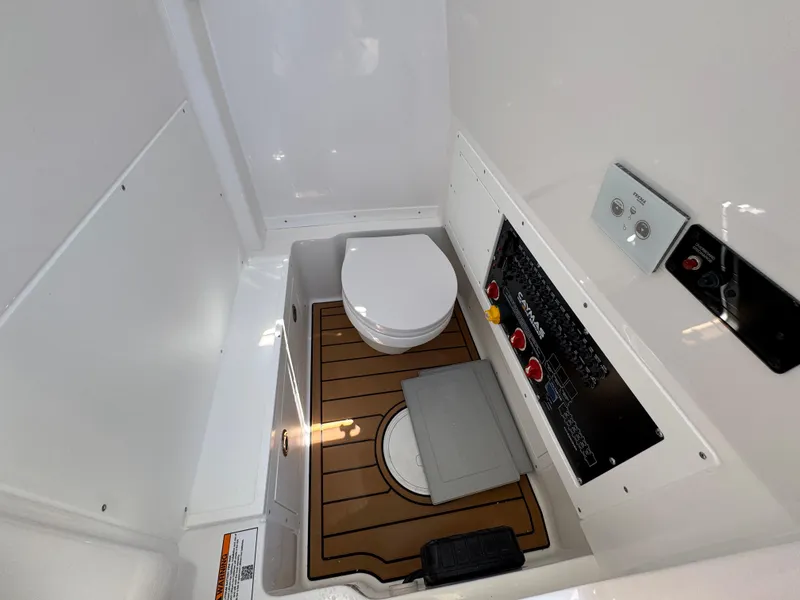 Slide: The Image of 2025 Caymas 291 boat interior with toilet and control panel. - 28