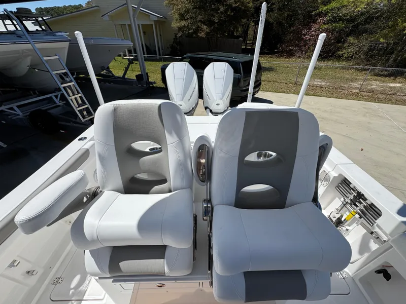 Slide: The Image of 2025 Caymas 291 boat with dual cushioned seats and modern design. - 31