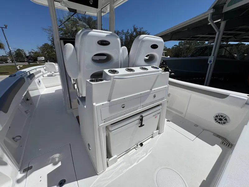 Slide: The Image of 2025 Caymas 291 boat interior with dual seats and storage compartments. - 35