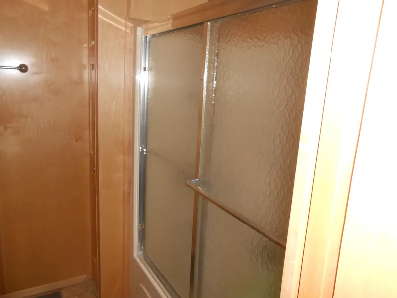 Slide: The Image of Shower area in 2008 Sumerset 7518 houseboat with frosted glass door. - 13