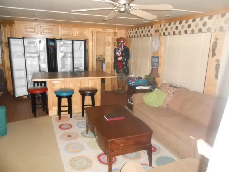 Slide: The Image of Living area in 2008 Sumerset 7518 houseboat with kitchen island and colorful stools. - 2