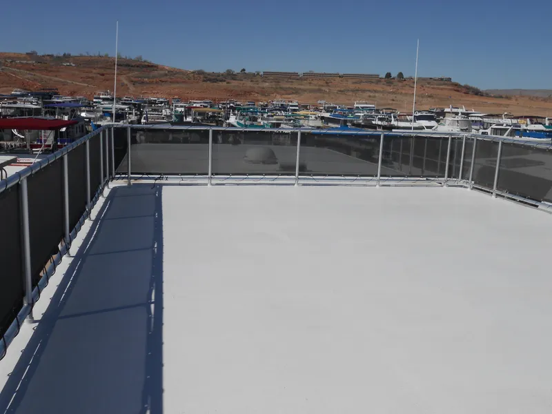 Slide: The Image of Rooftop deck of 2008 Sumerset 7518 houseboat, overlooking marina with clear blue sky. - 24